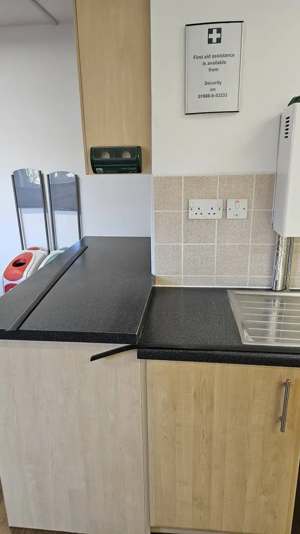 Office kitchenette cleaning near first aid point