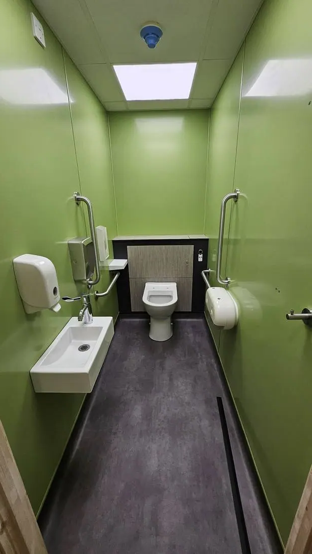 Office washroom sink and fittings cleaning detail